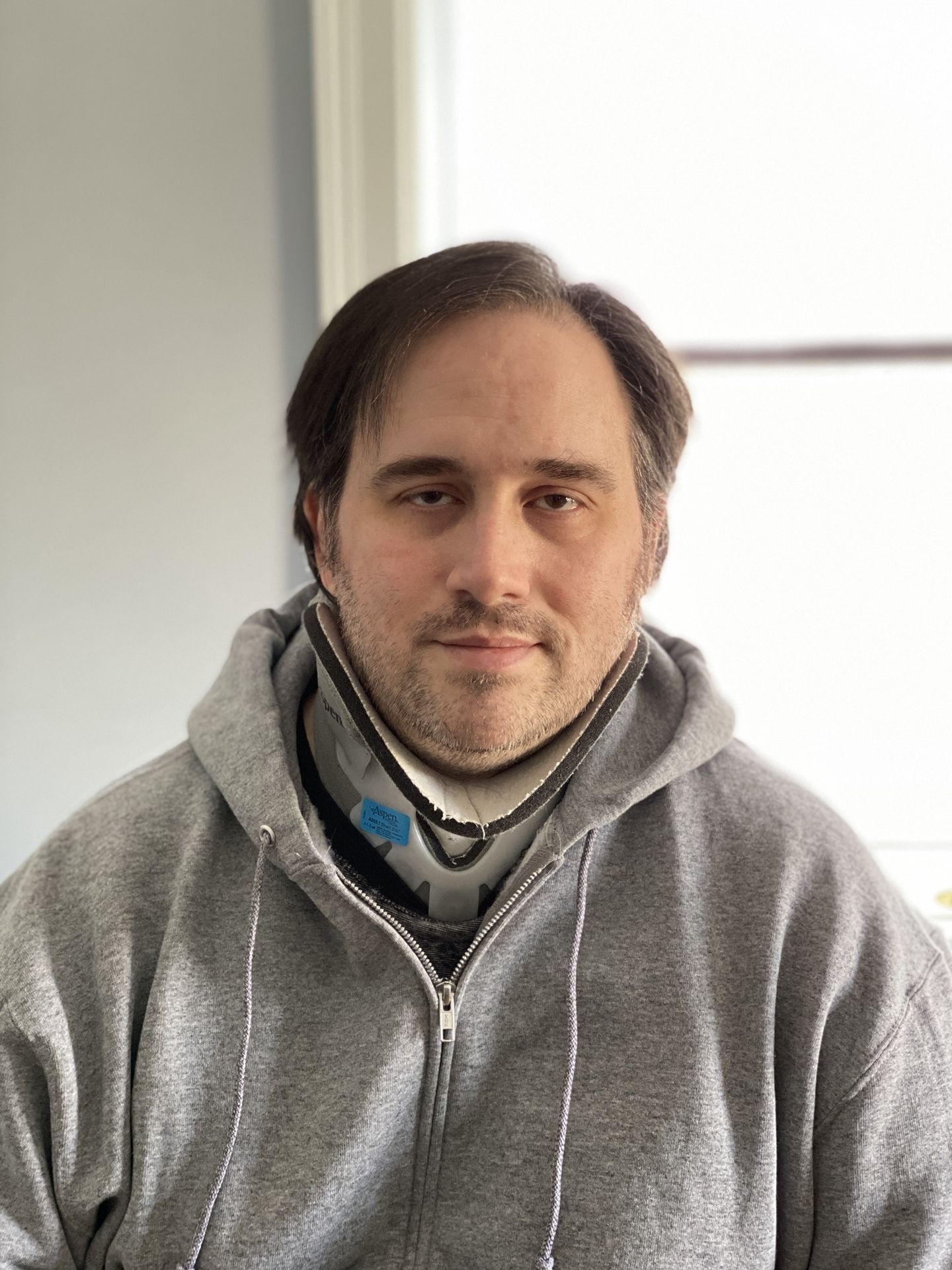 Author wearing cervical collar, full size